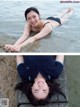 A woman laying on the edge of a body of water.